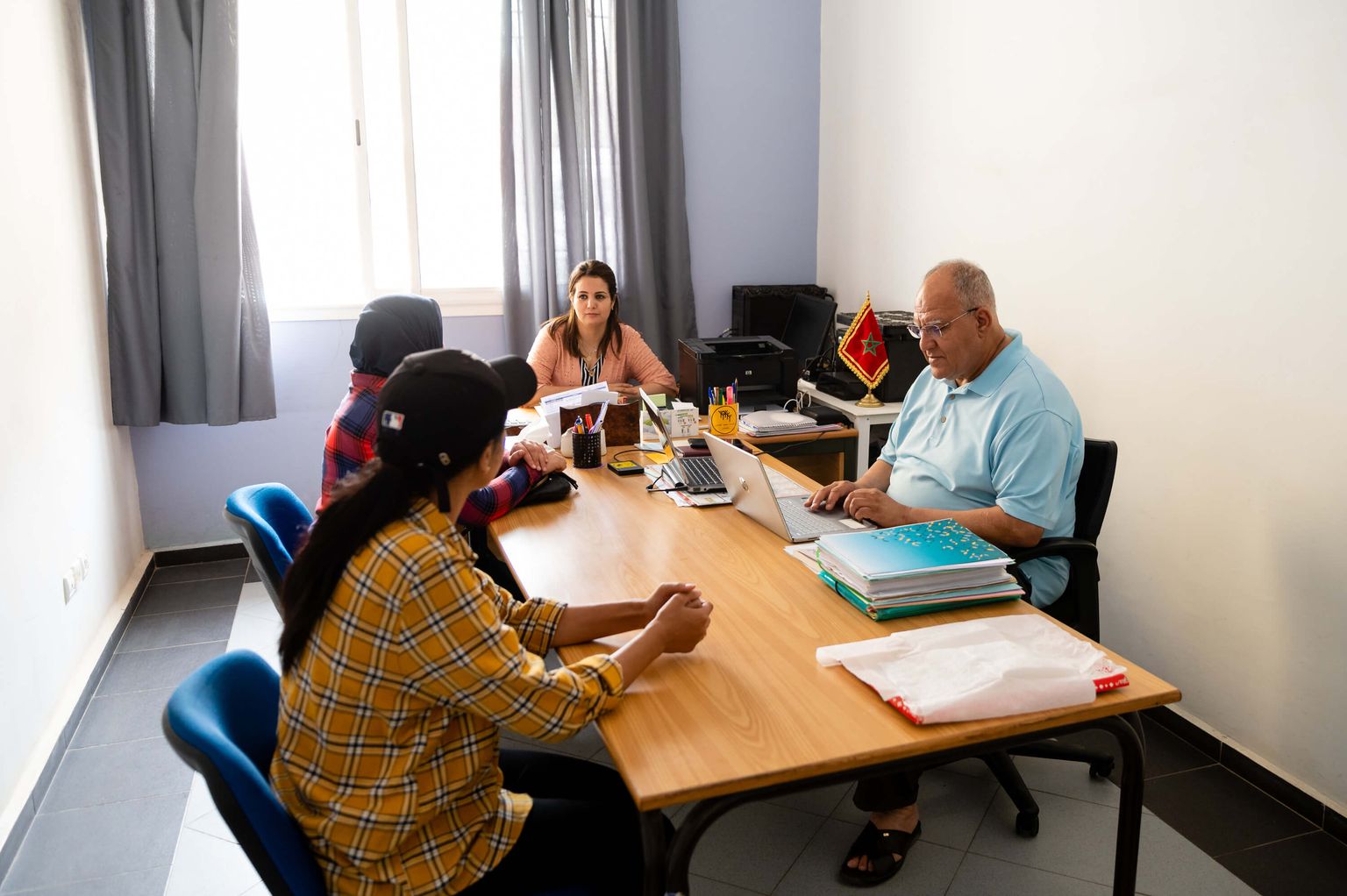 Mr. Tabyaoui in a meeting with his team.