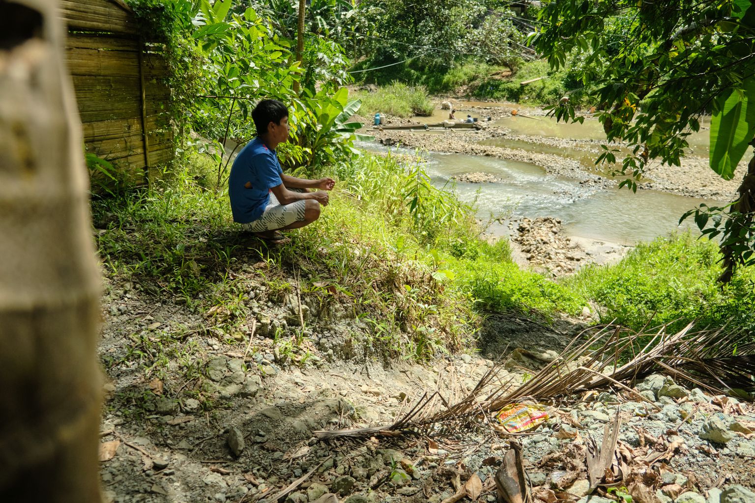 Eron Flores visits the river where artisanal and small-scale miners pan for gold.