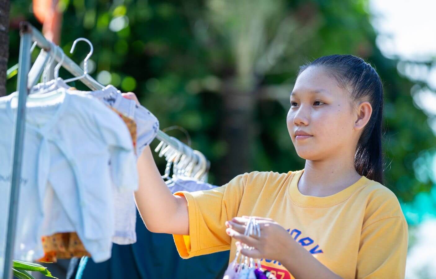 Ngan hangs some laundry as part of her daily household chores.